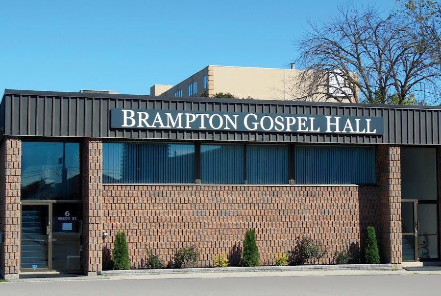 Brampton Gospel Hall, a single-storey brick building with the hall's name in white letters along its dark fascia